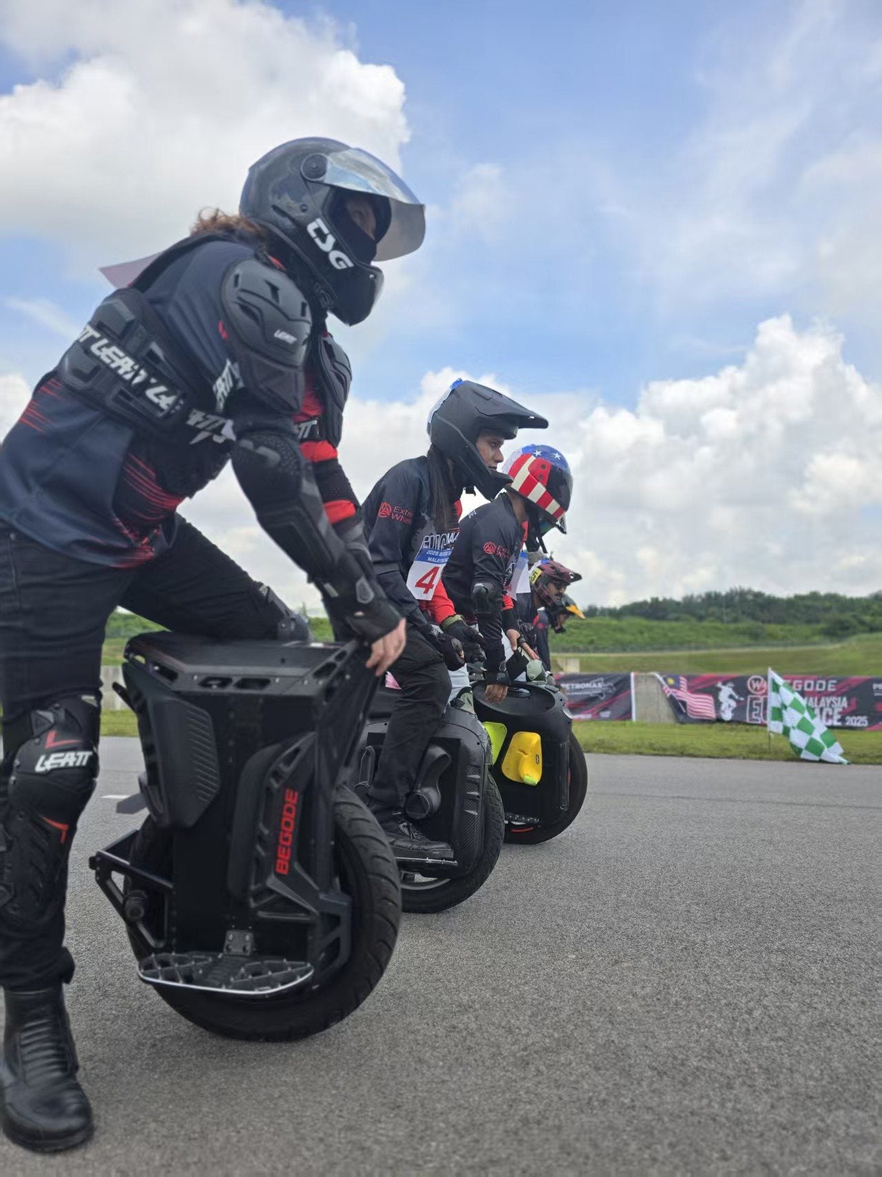 BEGODE riders on a paved race course in 2025