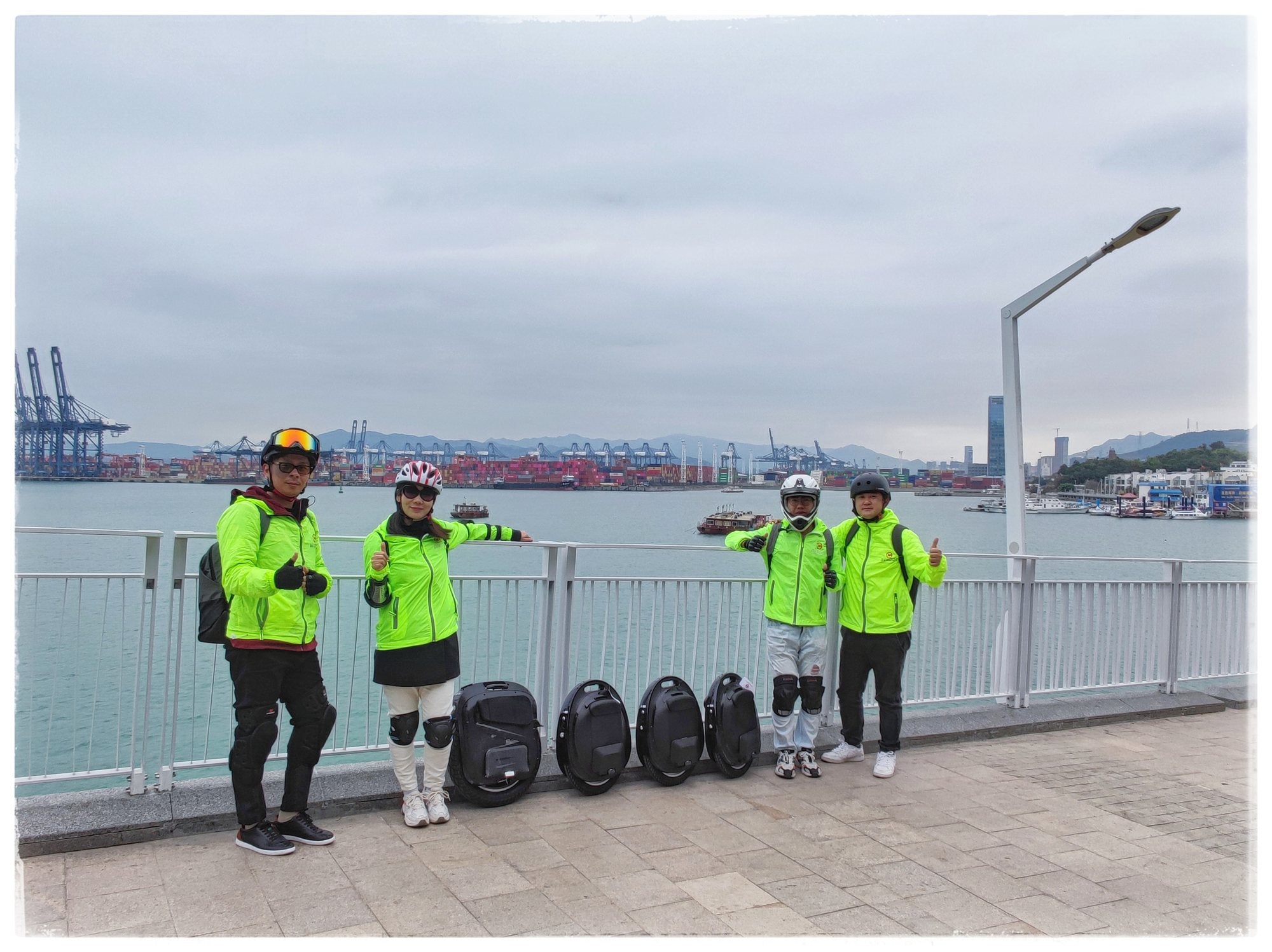 Begode riders with electric unicycles beside the waterfront in 2020